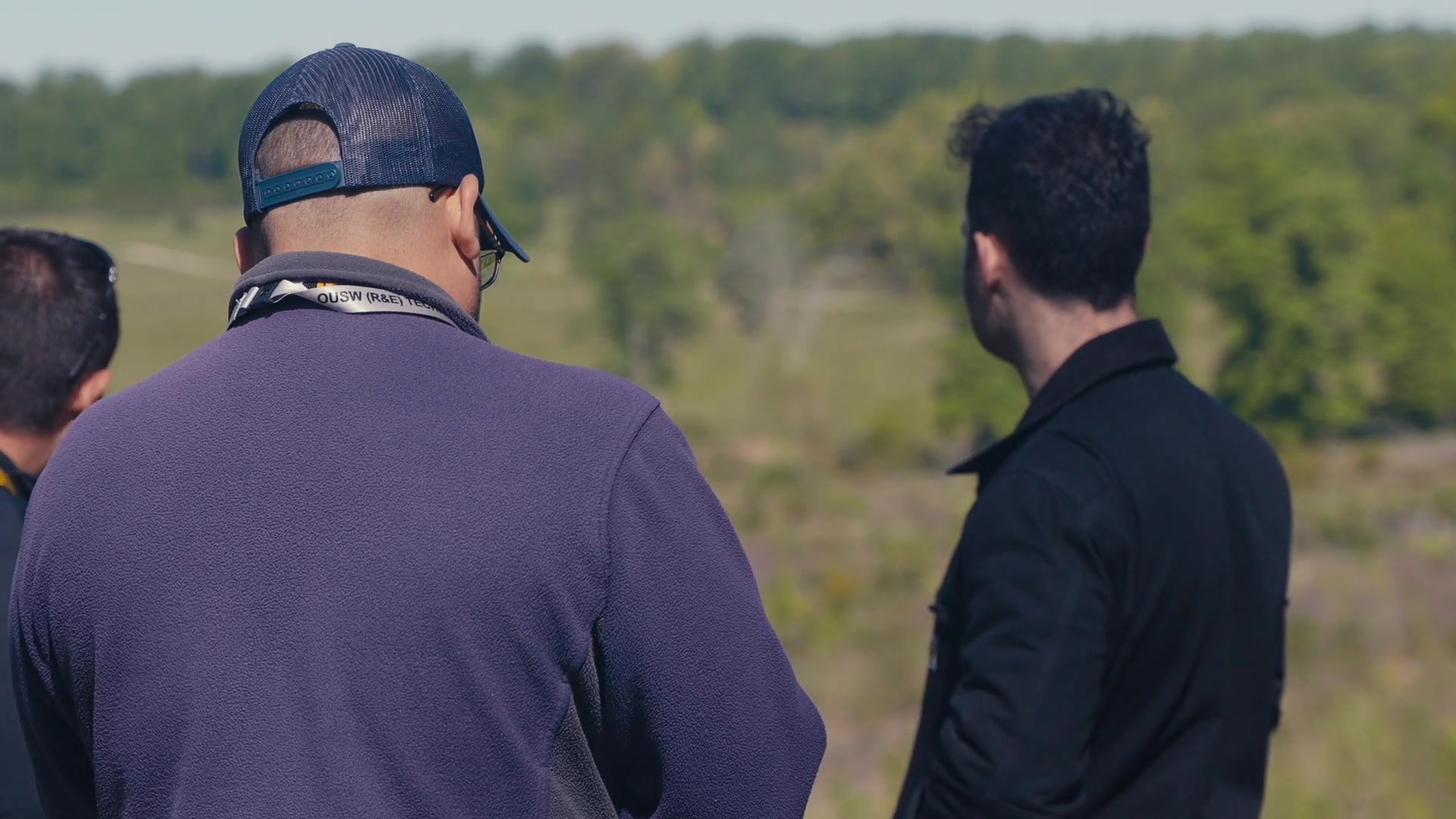 Civilian participants observing a daytime field test