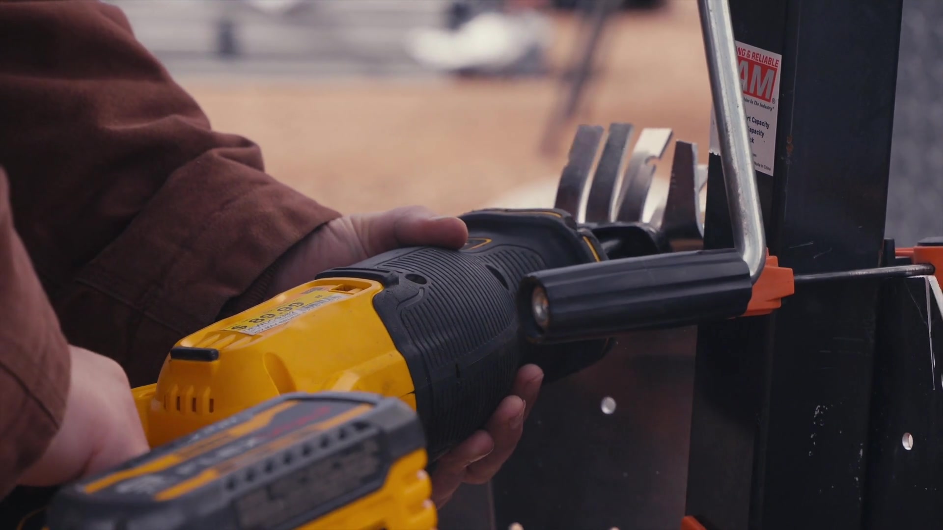 Documentary close-up of hands fabricating a hardware part in the Aurelius workshop