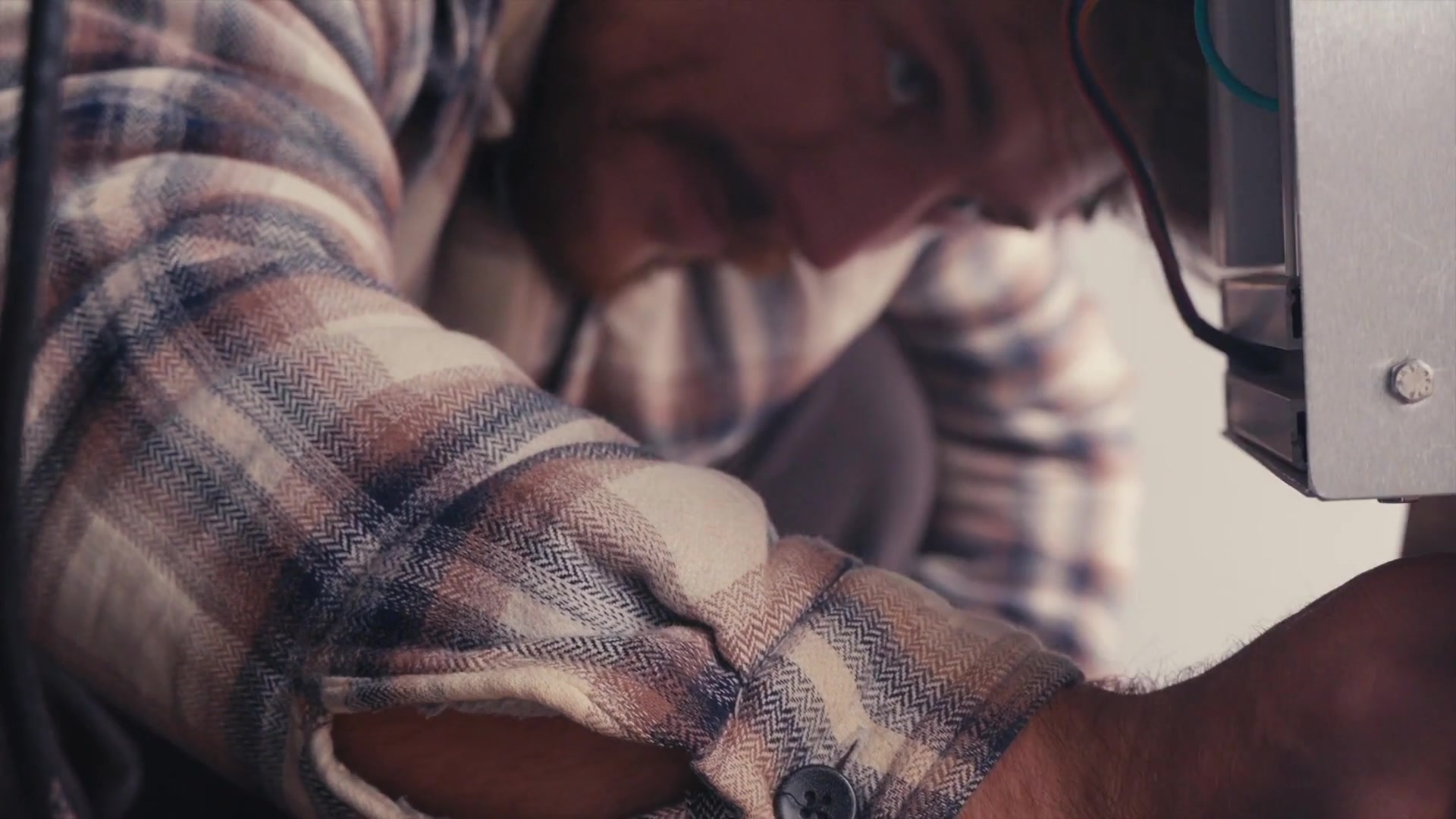 An Aurelius engineer working hands-on at a hardware bench